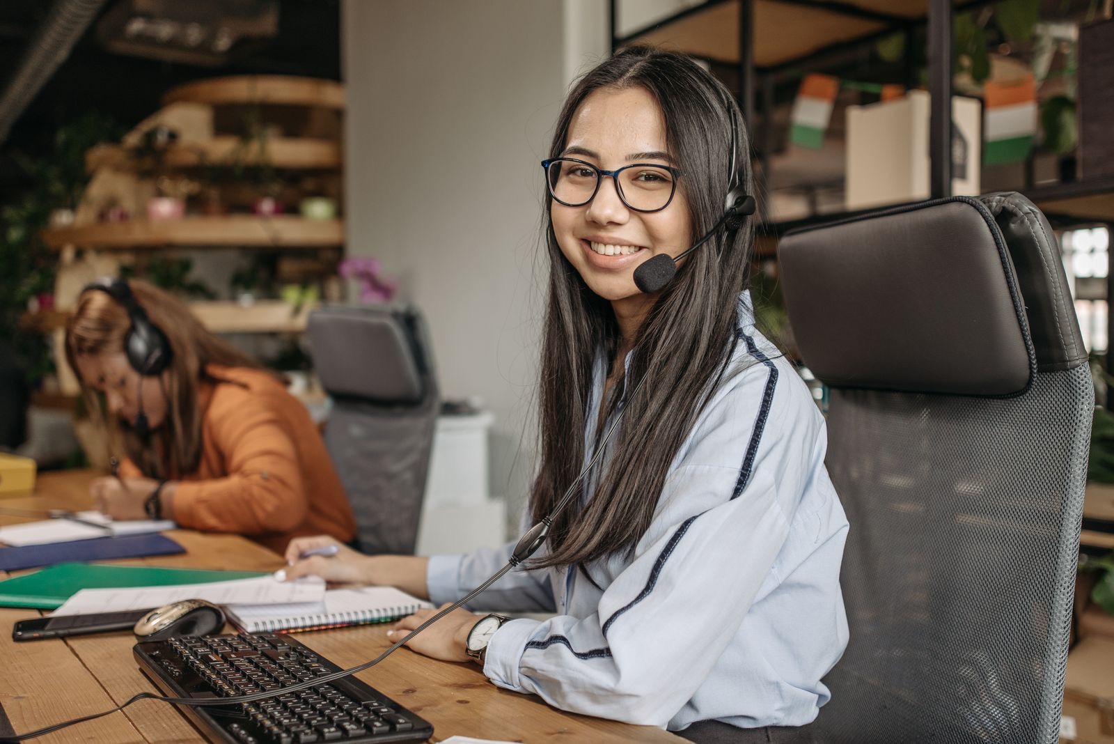 Smiling customer service associate wearing a headset